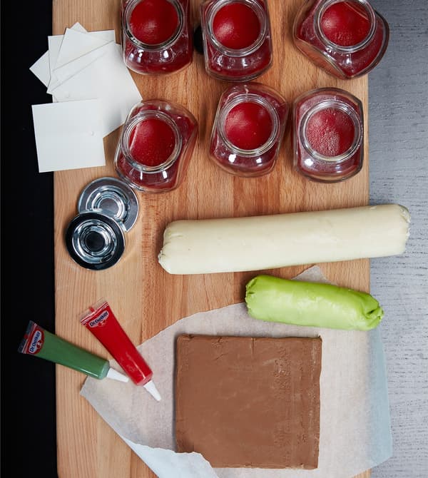 A bird’s-eye view of the ingredients for eyeball treats laid out on baking surface.