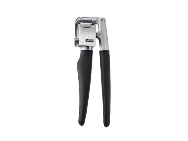 A black and silver garlic press