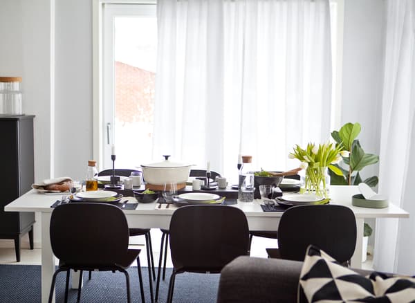 A black-and-white dining table and chairs.