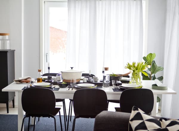 A black-and-white dining table and chairs.