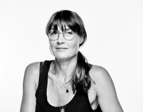 A black and white portrait of Josefine Aberg, the Vice President of Design at Adidas.