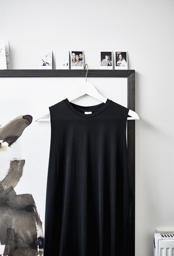 A black cow hide rug in a bedroom.