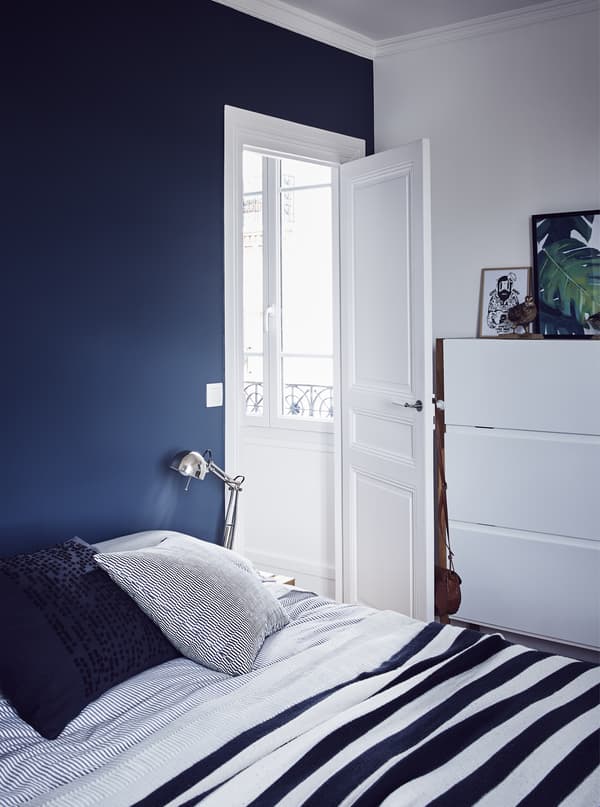 A blue and white bedroom.
