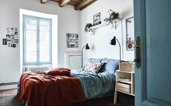 A blue and white bedroom.