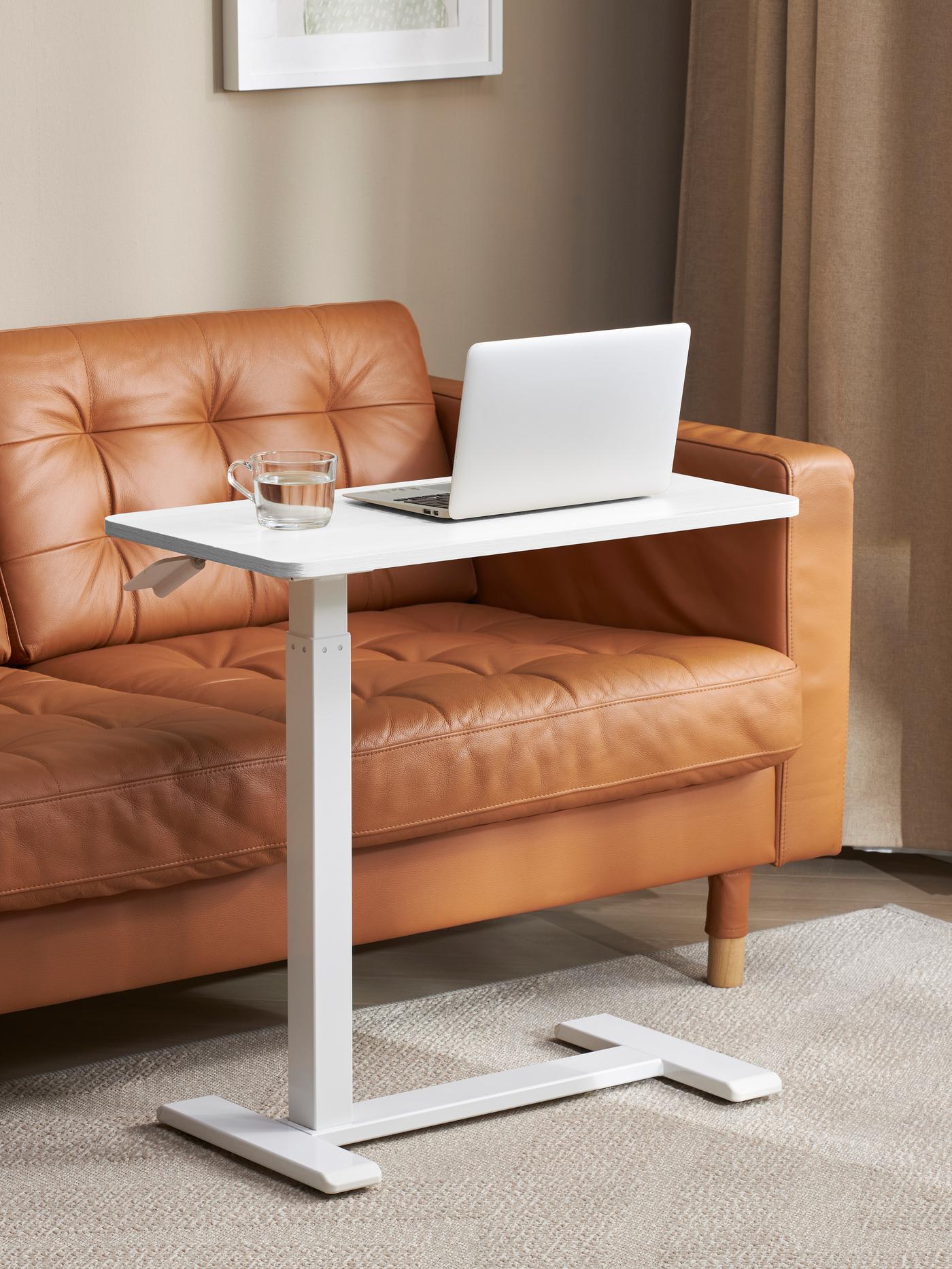 A BOLLSIDAN laptop stand in white with a laptop.