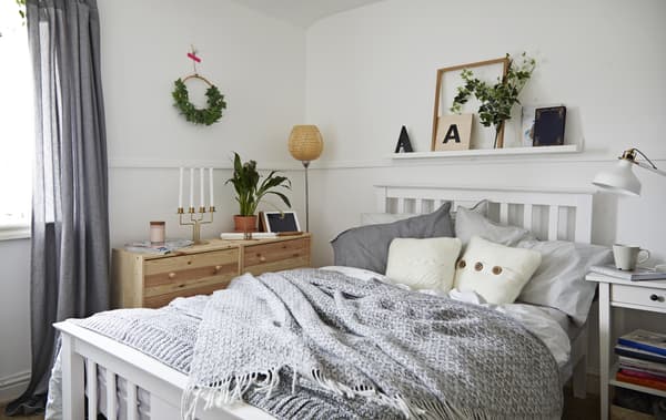 A calm bedroom in neutral colours.