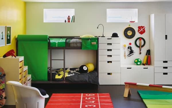 a childrens room with a grey bunk bed and white storage combination