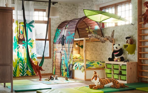 A children's room with stuffed animals and a bunk bed with a canopy