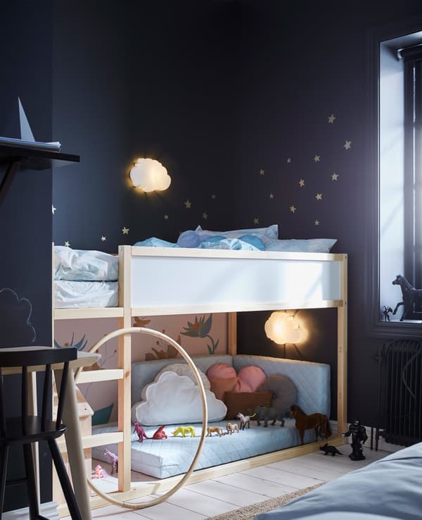 A child’s area in a shared bedroom. This reversible loft bed has sleeping space on top and a play area underneath.