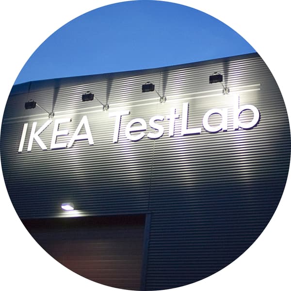 A circular image of a building with the words IKEA TestLab. 
