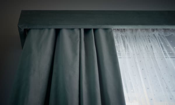 A close-up image of a homemade window cornice.