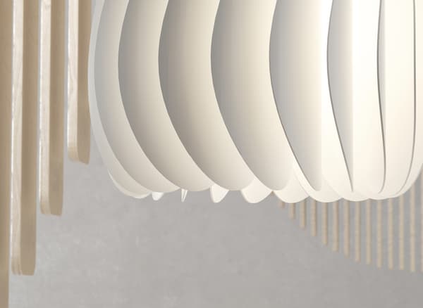 A close-up of a curved white lampshade.