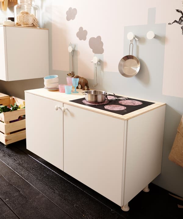 A close up of METOD on legs, which is now a children’s play-kitchen.