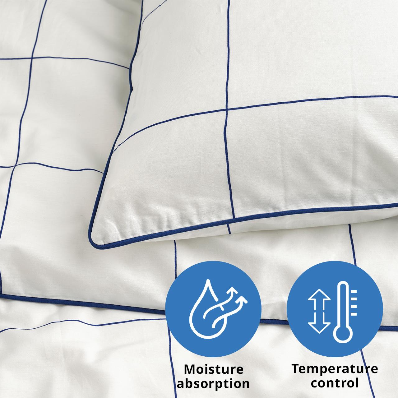 A close-up shot of white/blue checked BREDVECKLARE duvet cover with pillowcase.