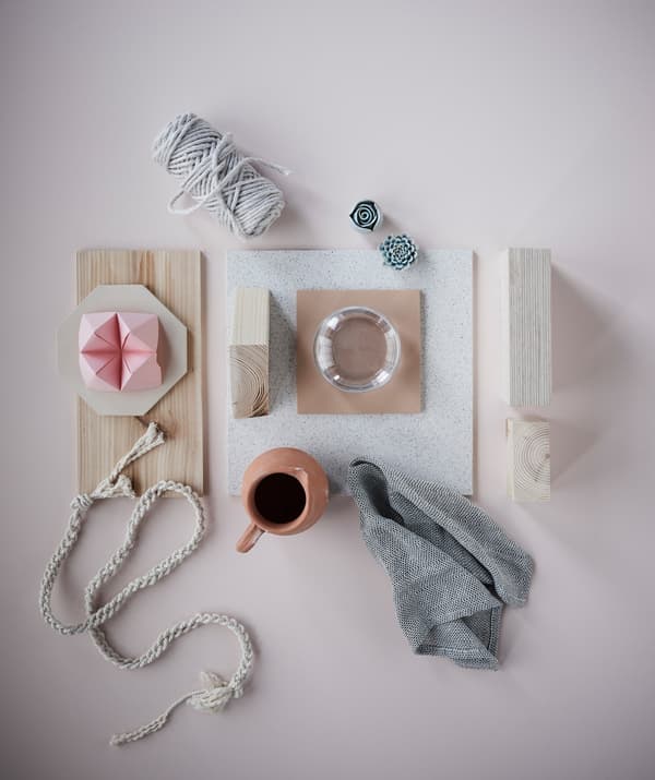 A collage of light wood, textiles and ceramics.
