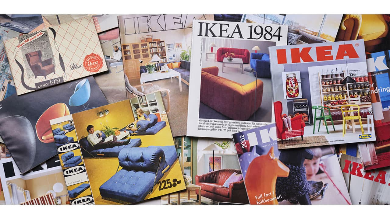 A collage of various colorful IKEA catalogs from various years throughout the decades.