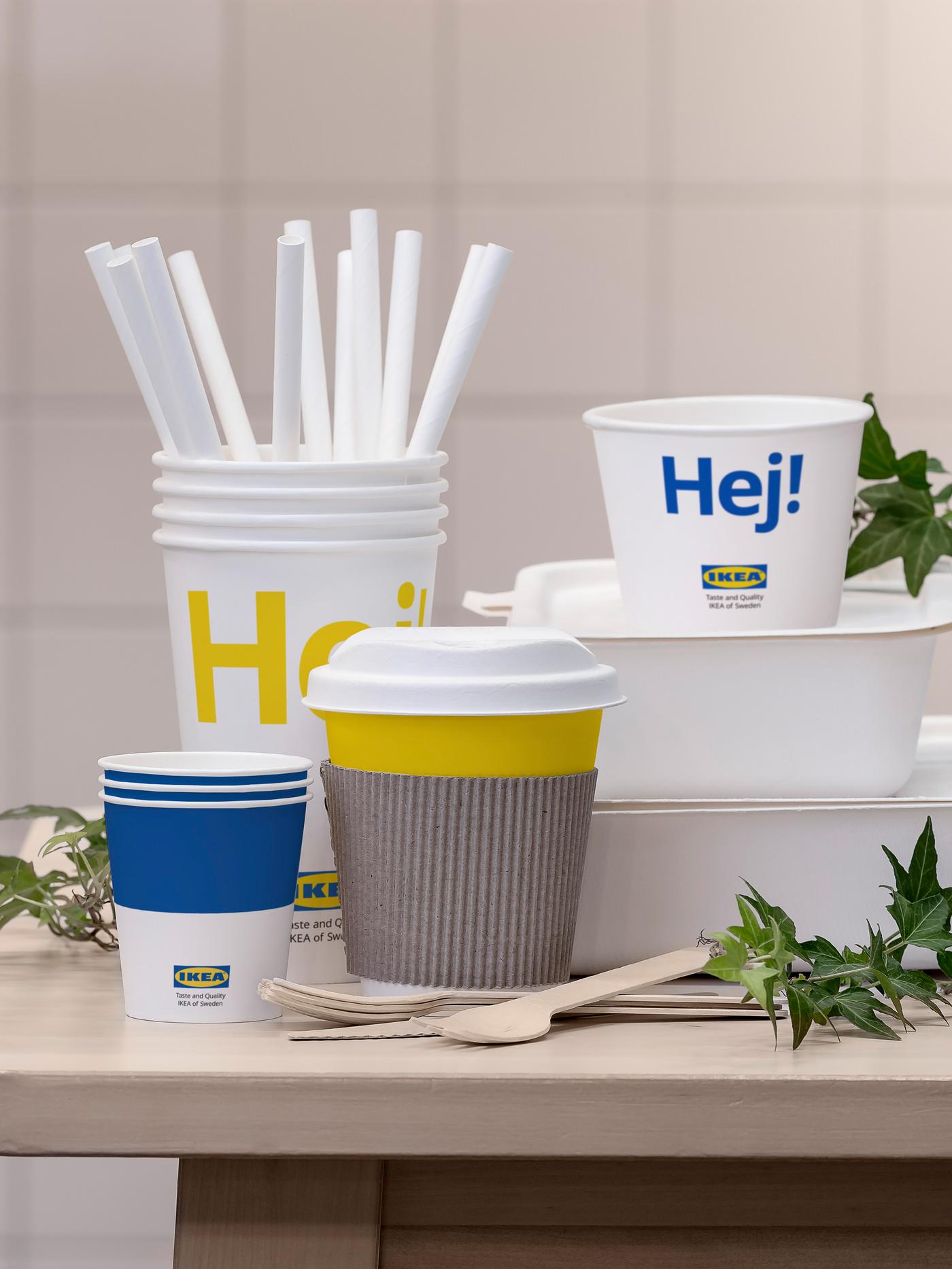 A collection of take-away food packaging including cups, straws and boxes, some with the IKEA logo and the word “Hej”.