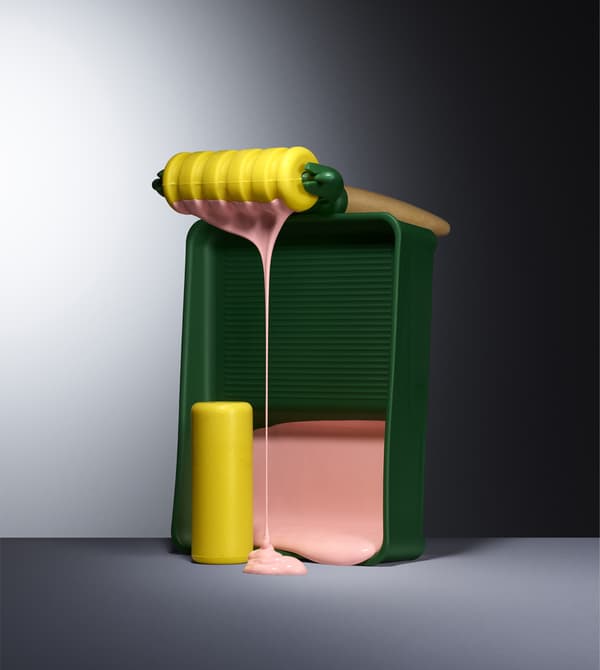 A colourful paint roller set with dripping pink paint