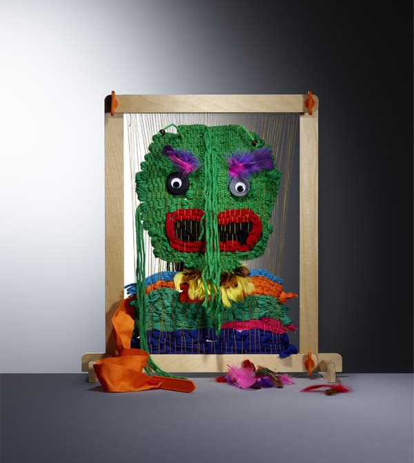 A colourful wooden weaving loom