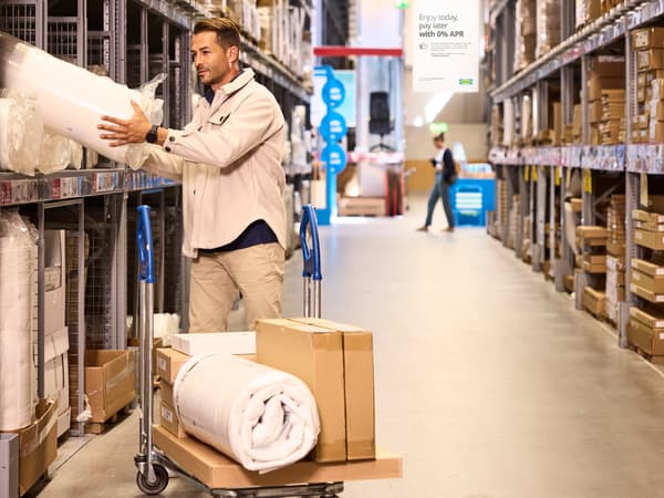 A customer shopping in store with big items