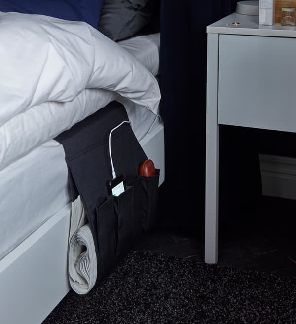 A dark blue padded curtain and dark blue blind combination at the window will block out more light and sound than regular curtains.