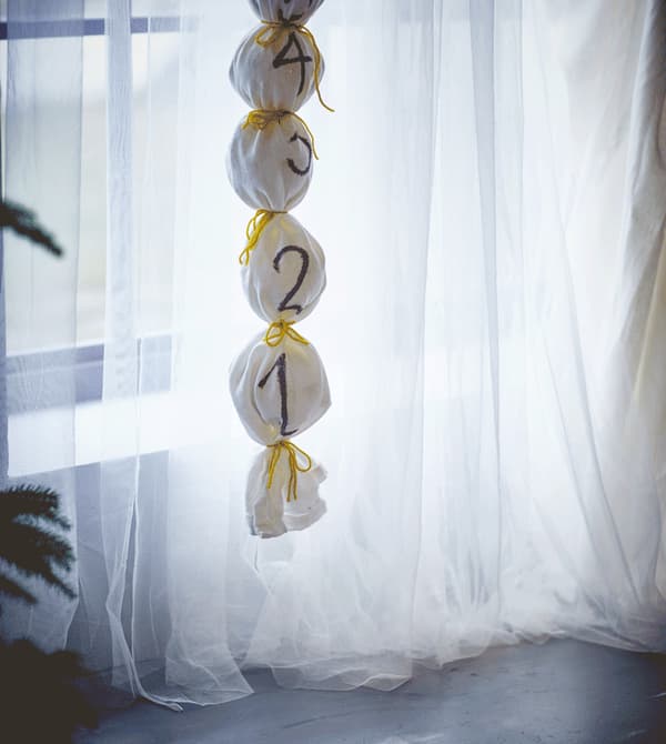 A decorative Advent calendar hangs from the ceiling.