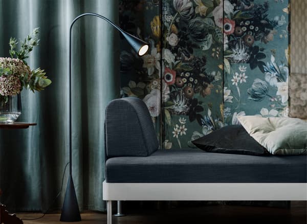 A DELAKTIG sofa section and detachable reading lamp.