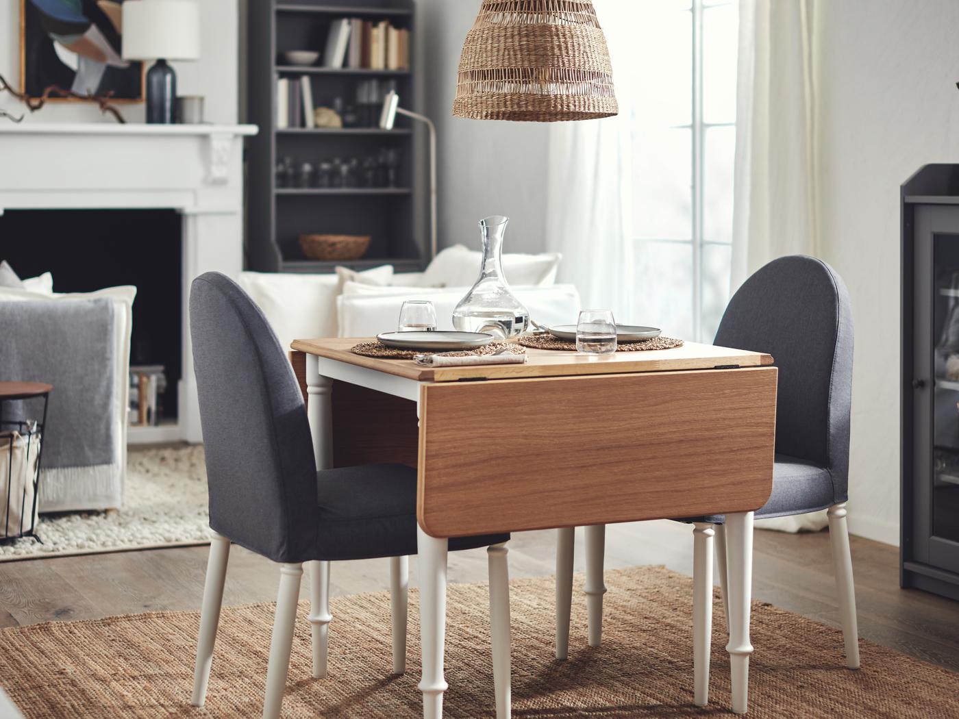 A dining set of DANDERYD chairs round an oak-veneer-and-white DANDERYD drop-leaf table in an airy, light room.