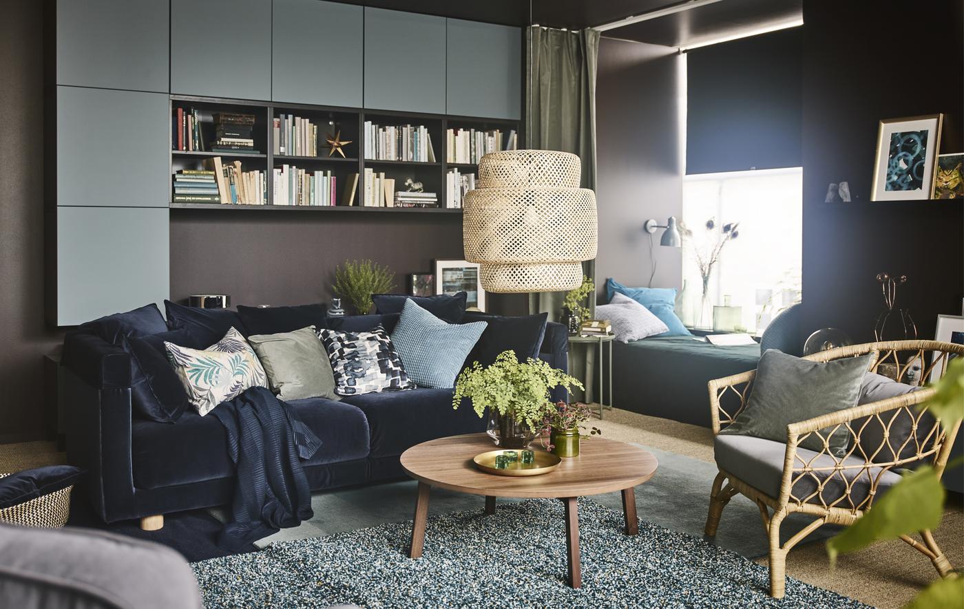 A dream living room for IKEA envisioned by Åsa Dyberg, one of Sweden’s top interior designers. The result is a cosy ‘do it all’ space with a velvet sofa in dark blue, a walnut coffee table, and a daybed with a green curtain that allows for privacy.