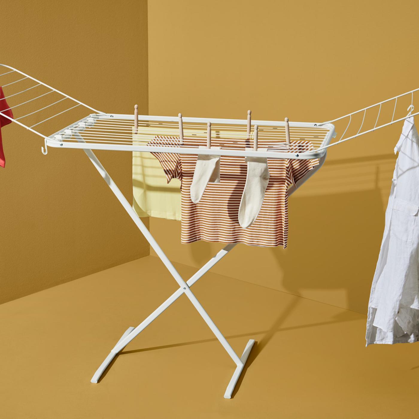  A drying rack on an ocher background.