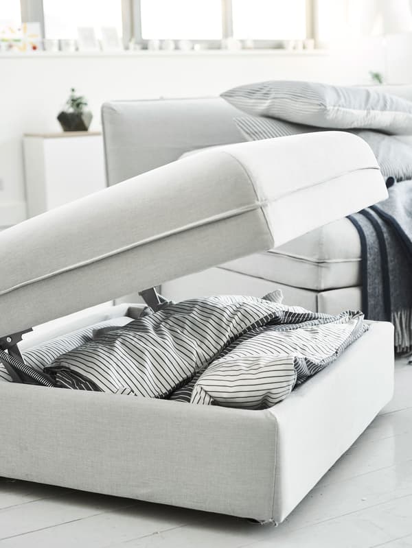 A footstool with built-in storage.
