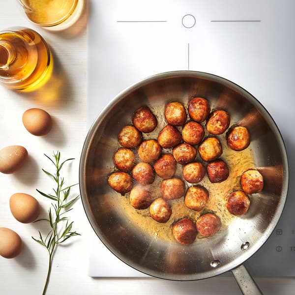 A frying pan filled with IKEA Swedish meatballs.