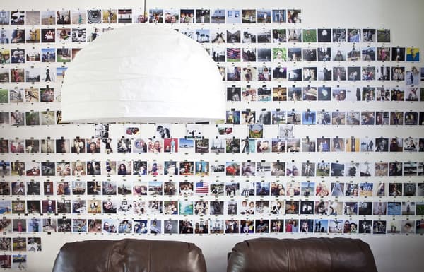 A gallery wall covered in Polaroid photos.