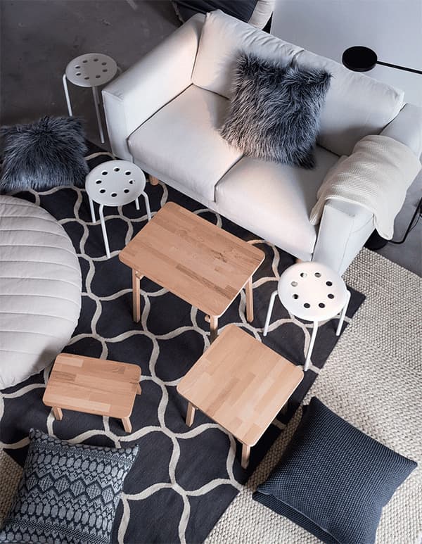 A GIF animation showing how stools, cushions and tables can be added to a living space to create additional seating.