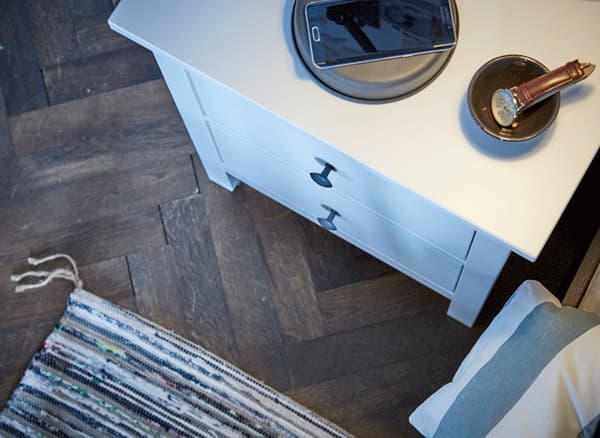 A GIF of a bedside table drawer being opened to reveal a MOLGAN LED light inside.