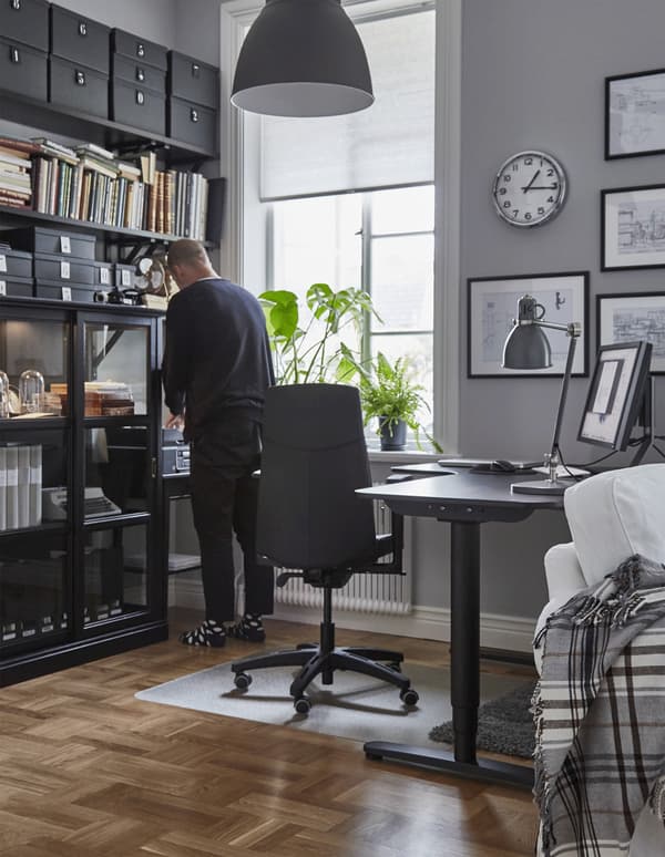 A GIF of a person moving around their home workspace that’s designed to be ergonomic.