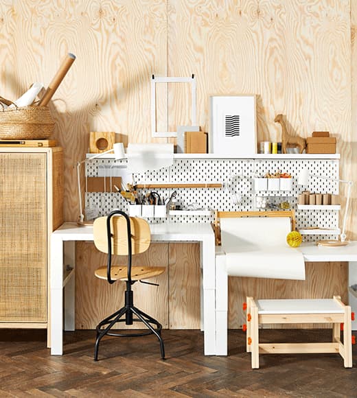 A GIF of the function of side-by-side height adjustable children’s desks and adjustable office chairs in a home office.