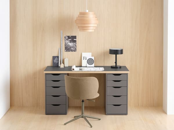 A grey/wood effect LAGKAPTEN table top with two grey ALEX drawer unit.
