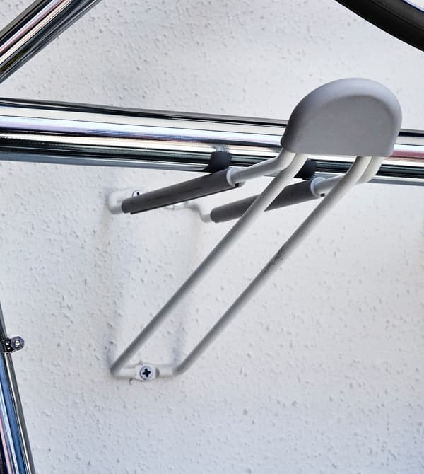 A hook in a wall supporting an airer.
