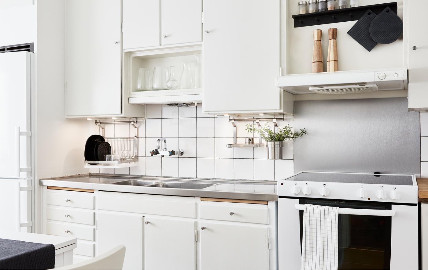 A kitchen is updated using simple space-saving ideas without breaking the bank.