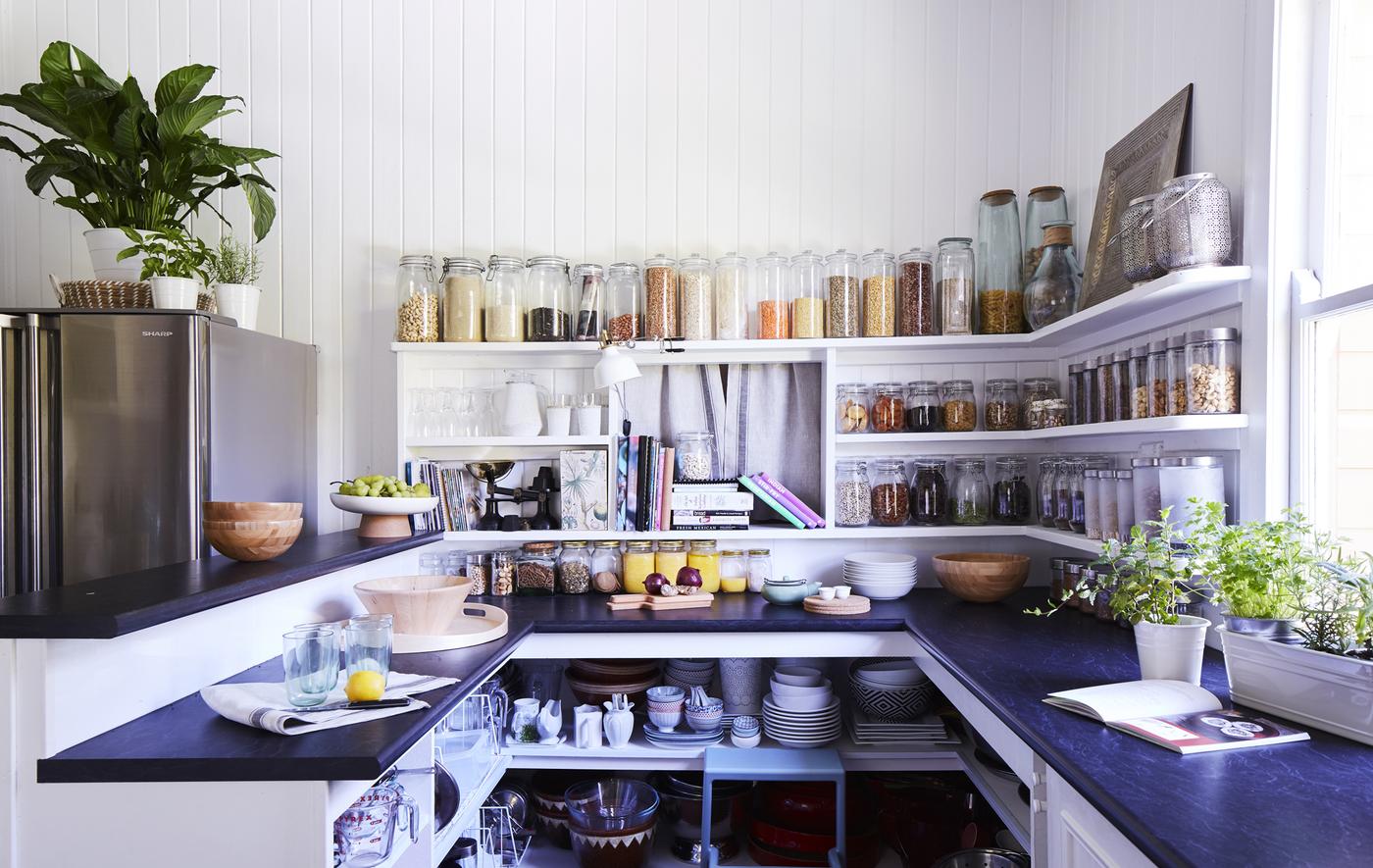 A kitchen with open storage.