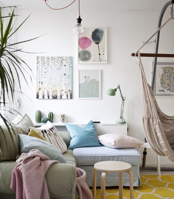 A living room decorated in pastel colours. 