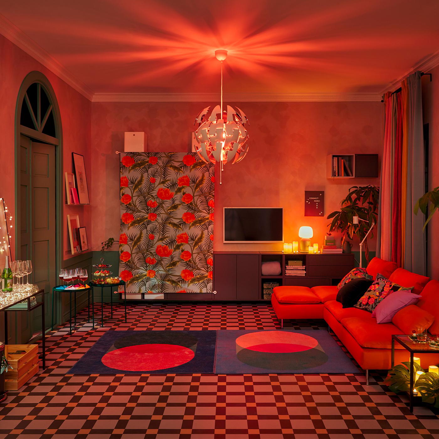 A living room set for a party with furniture along the walls, big dance floor and decorations and lighting for a club mood.