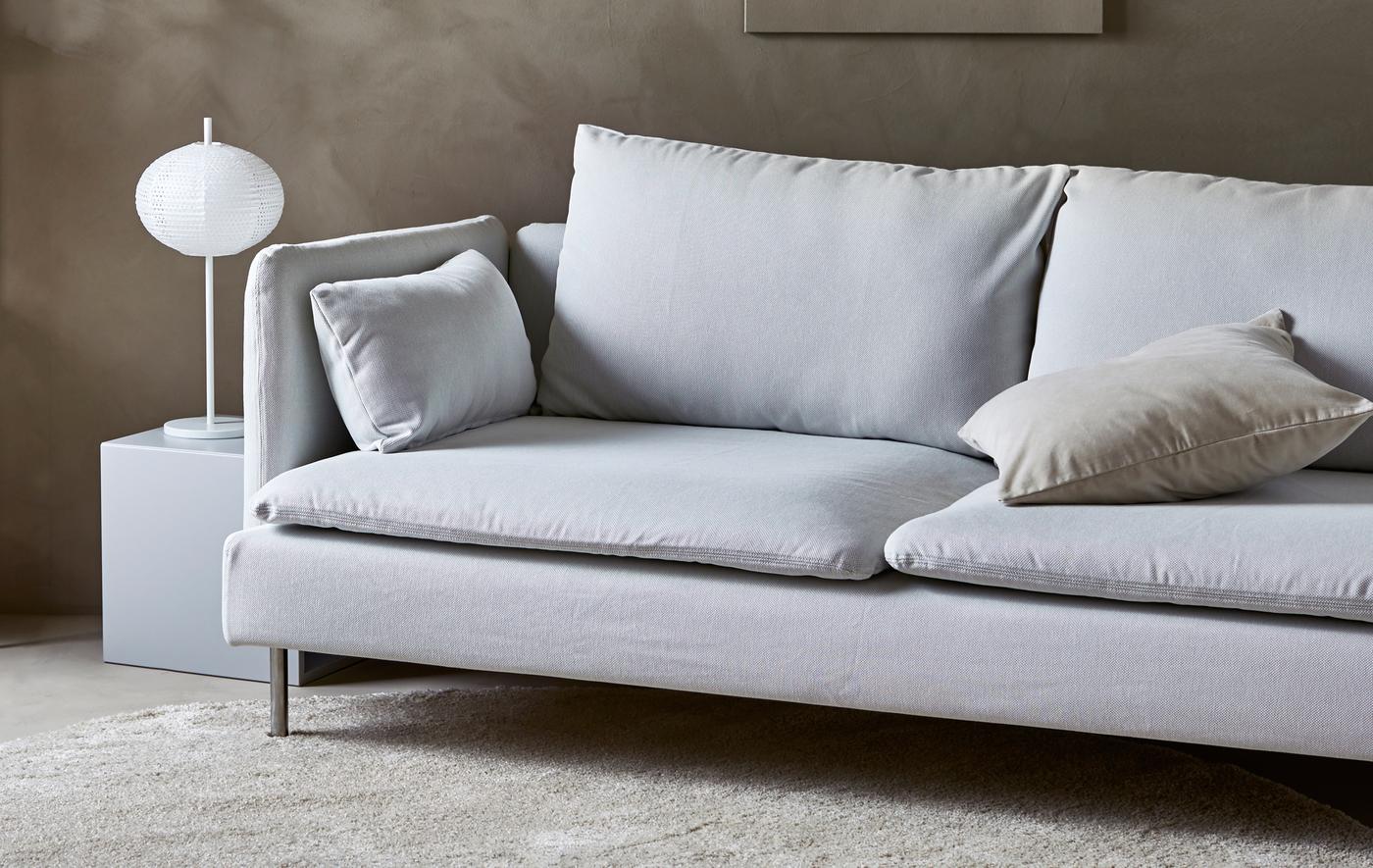 A modern sofa in a warm, sand-coloured minimalist style living room.