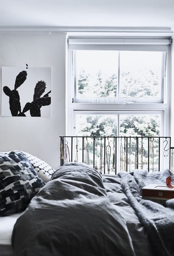 A monochrome bedroom with grey bedding.