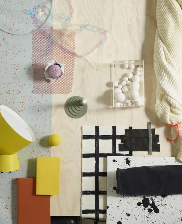 A moodboard of yellow, black and white colours and materials like soft cotton and natural pine wood.