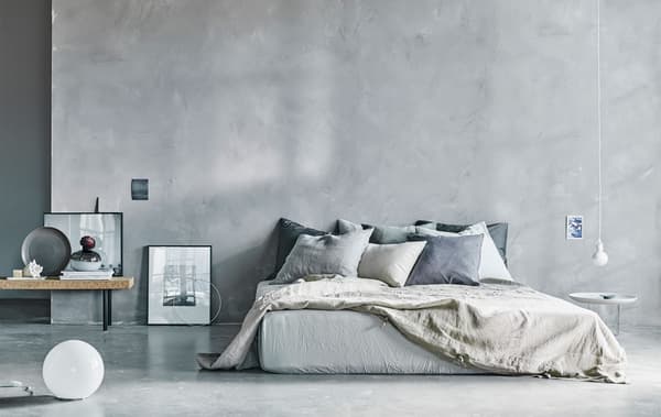 A natural coloured airy bedroom space.