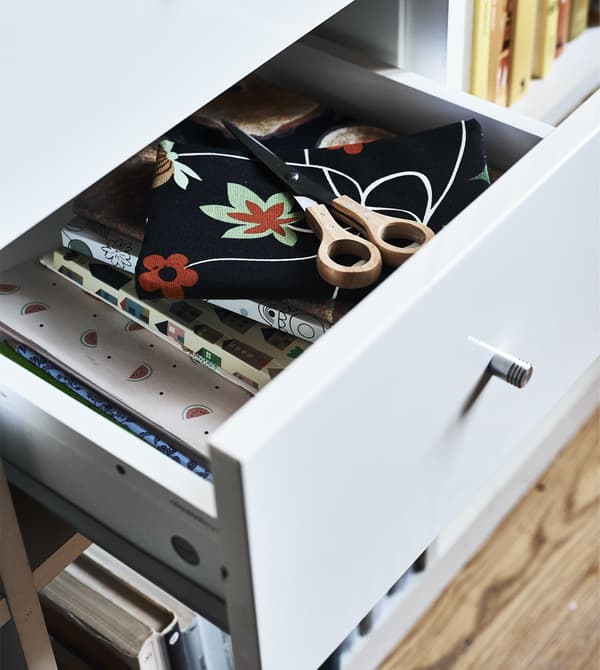 A open drawer in a KALLAX unit.