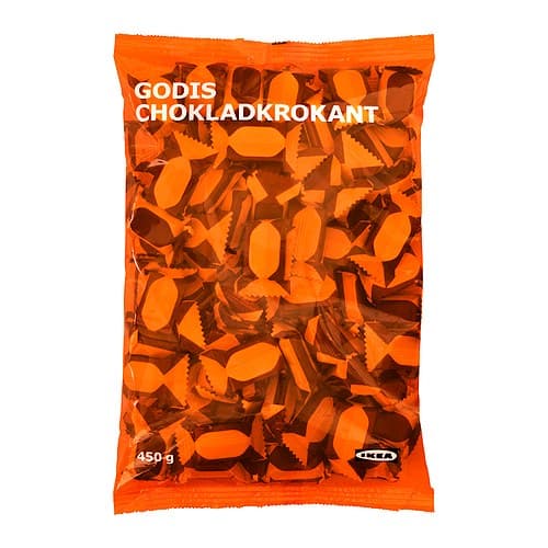 A package of GODIS CHOKLADKROKANT candy in an orange plastic bag.