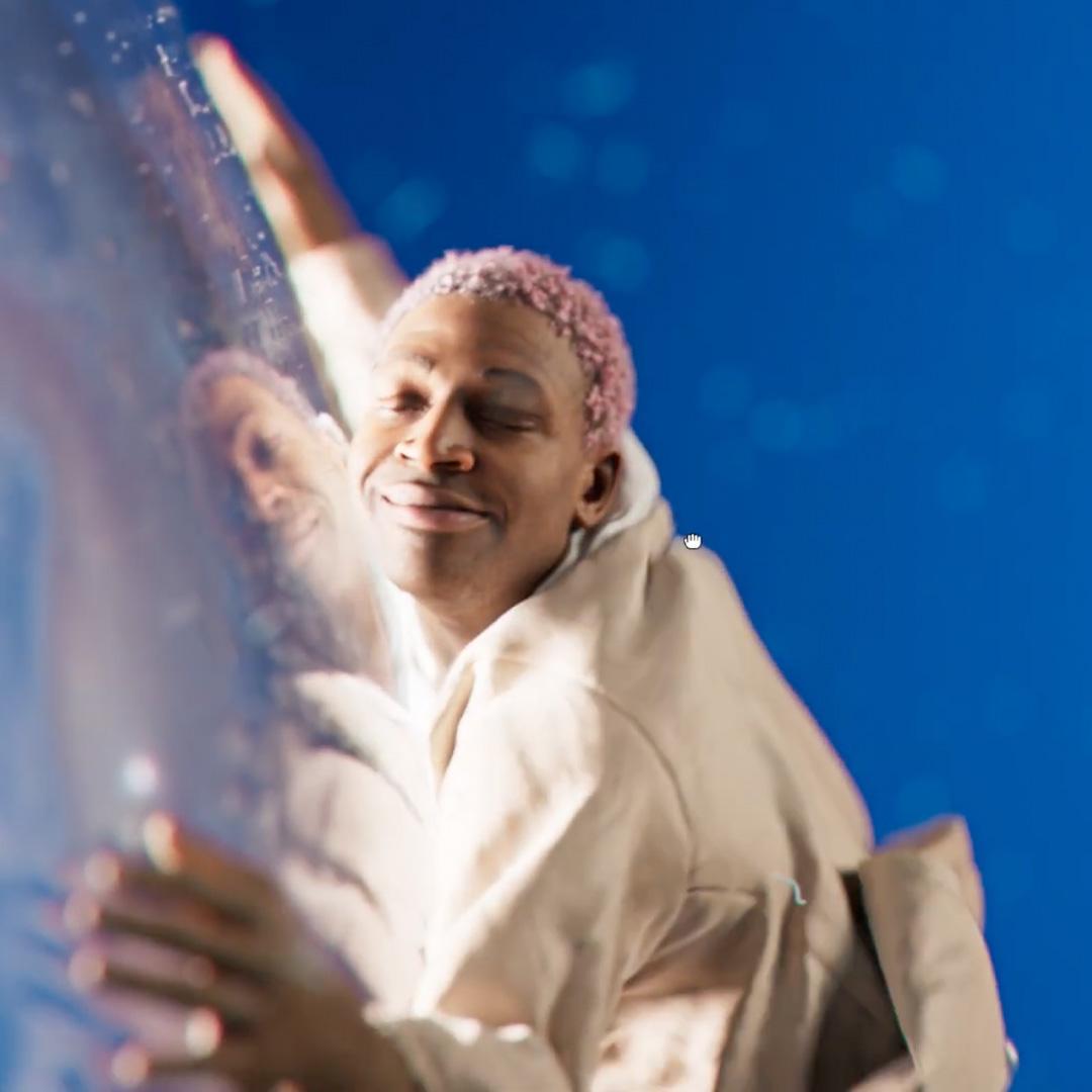 A person holding a giant light bulb.